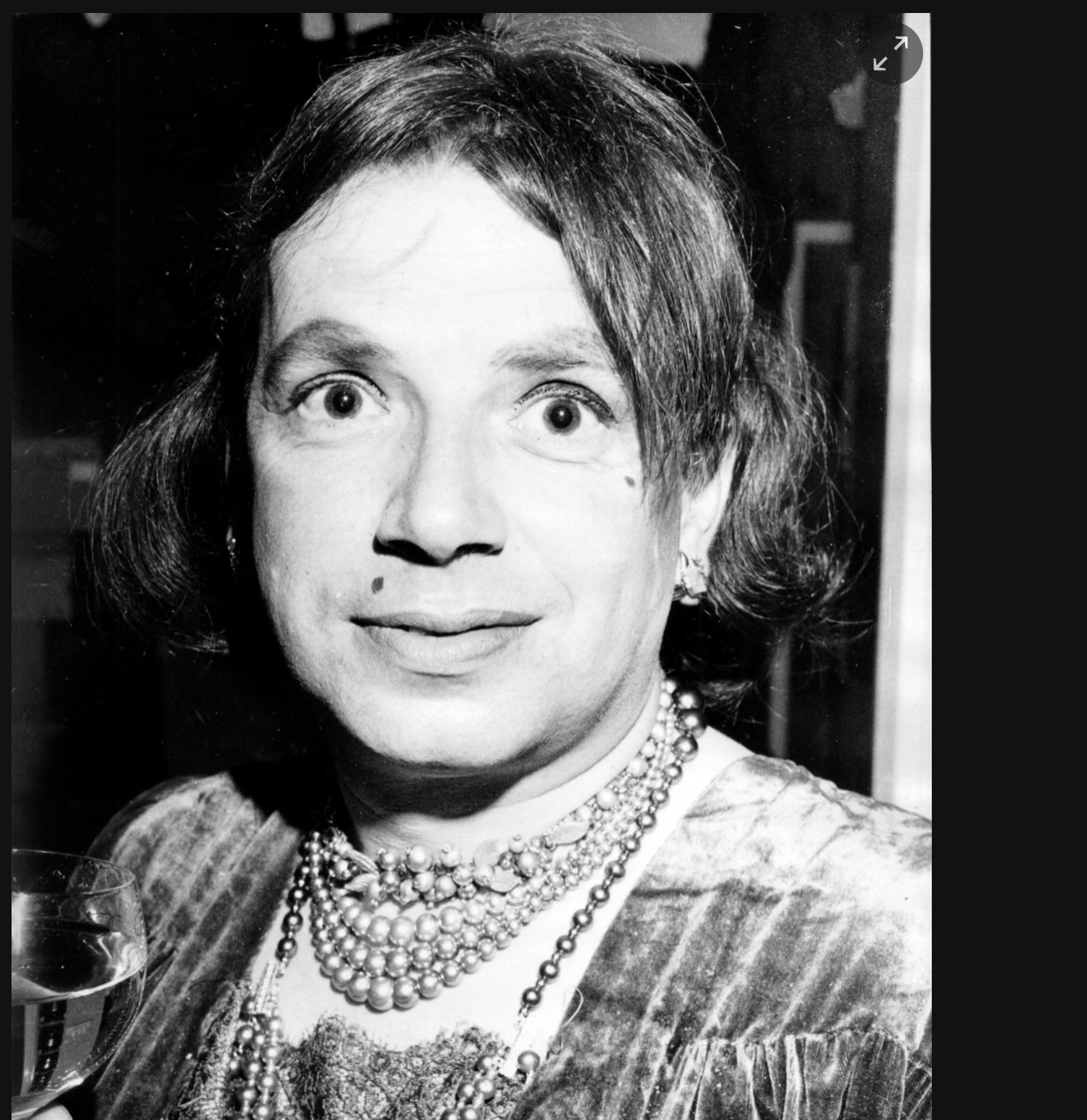 George Melly wearing drag and jewellery at the Colony Room Club