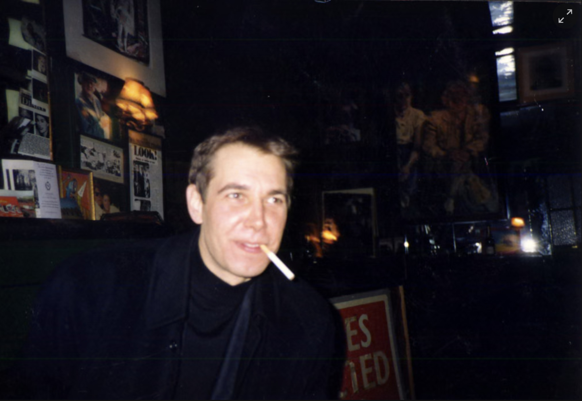 The artist Jeff Koons seated inside the Colony Room Club