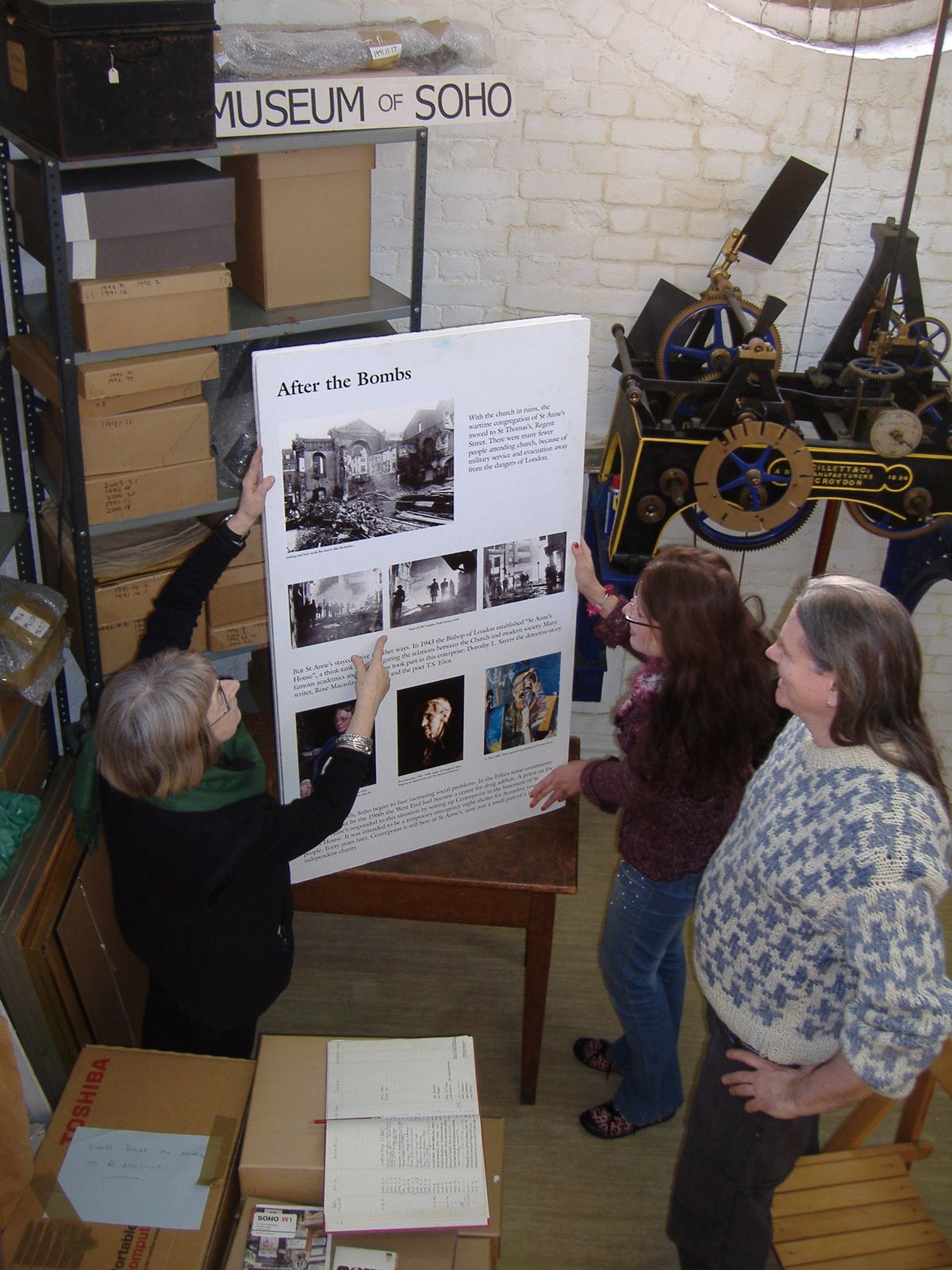 Museum of Soho material displayed beside the St Anne’s clock mechanism